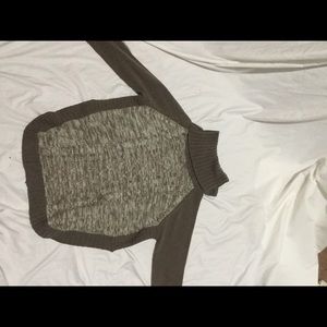 A brown turtle neck sweater